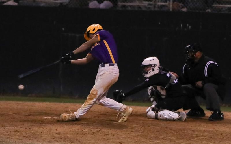 Columbia second baseman Goose Lord swings and misses at a pitch against Providence in the sixth inning Tuesday night. He struck out with the bases loaded. (BRENT KUYKENDALL/Lake City Reporter)