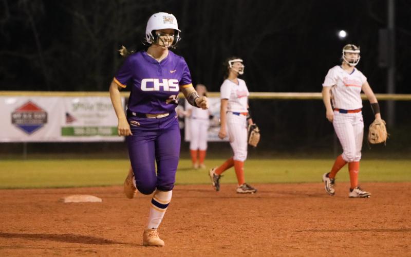 Columbia catcher Emily Delgado smiles running to third base after hitting a solo home run against Bronson on Thursday. (BRENT KUYKENDALL/Lake City Reporter)