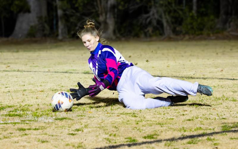 Branford goalkeeper Samantha Ray makes a save against Dixie County in the District 2-2A championship on Jan. 26. (JACK HOWDESHELL/Lake City Reporter)