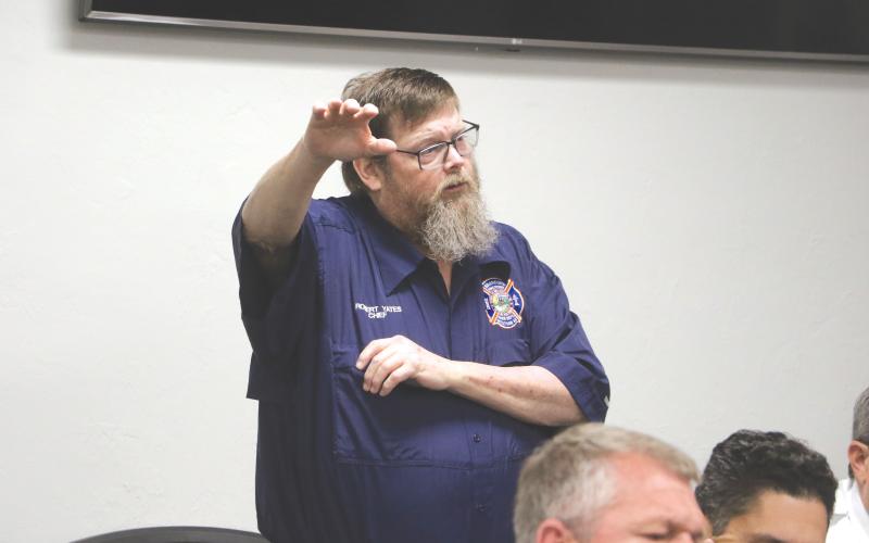 Robert Yates, shown speaking at a Branford Town Council workshop in January about consolidating its service into Suwannee County’s paid service, resigned as fire chief for the town last week. (FILE)