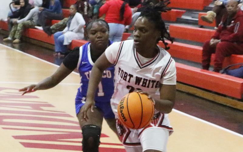 Fort White guard Zuri Hollie drives to the basket against Taylor County during the District 6-R championship on Feb. 6. (MORGAN MCMULLEN/Lake City Reporter)