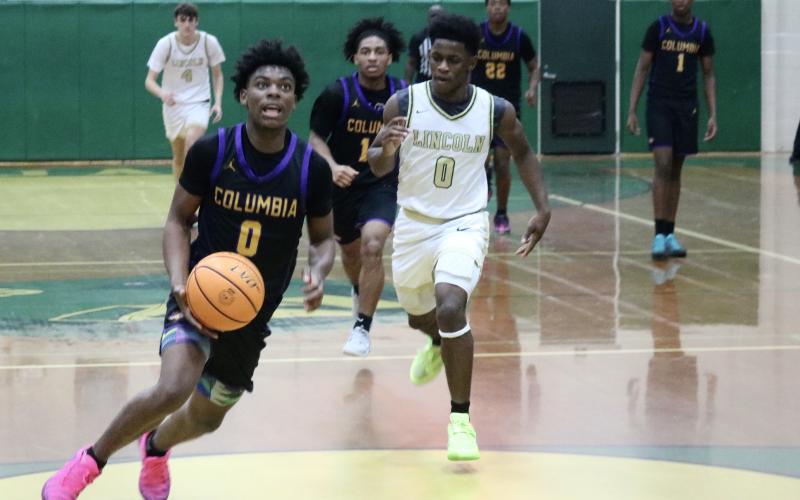 Columbia guard Murkail Cray races for a layup after snatching a steal against Lincoln in the fourth quarter of Saturday's Region 1-5A quarterfinal. (JORDAN KROEGER/Lake City Reporter)