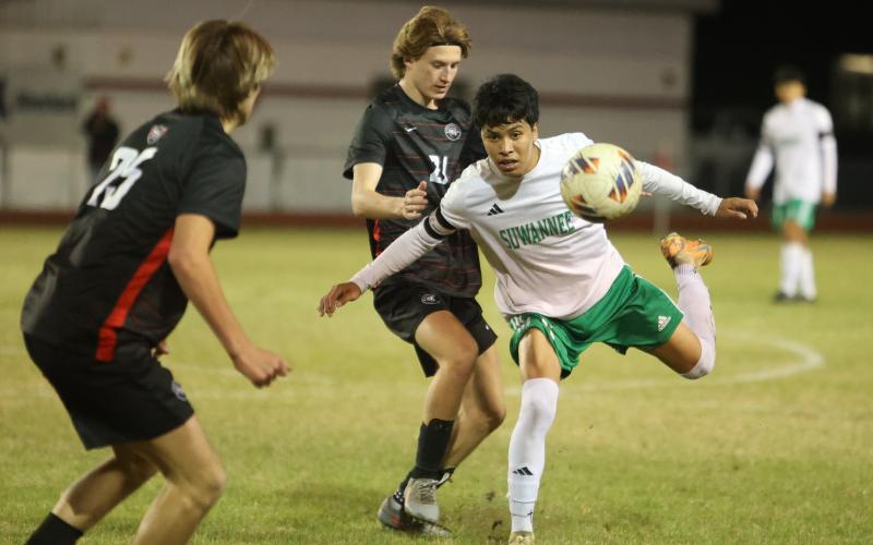 Suwannee midfielder Scott Uribe chases after possession against Santa Fe during Tuesday's Region 1-3A quarterfinal. (PAUL BUCHANAN/Lake City Reporter)