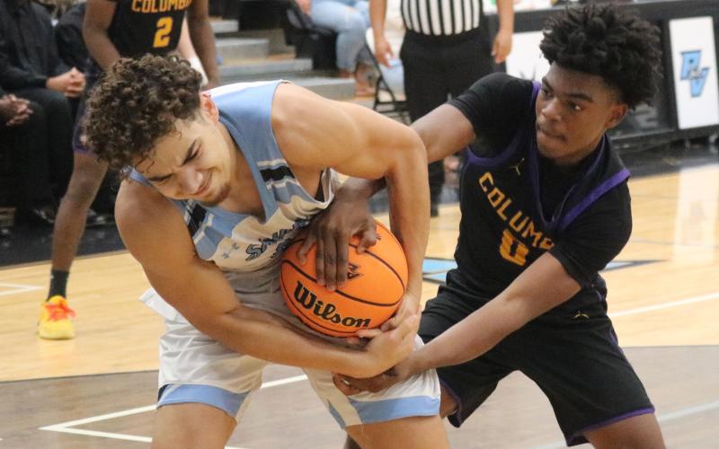 Columbia guard Murkail Cray fights for a loose ball with Ponte Vedra forward Maddox Palmer during Saturday's Region 1-5A semifinal. (JORDAN KROEGER/Lake City Reporter)