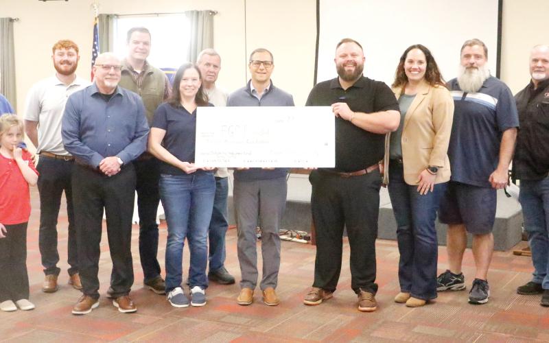 Members of the Kiwanis Club of Lake City doanted $12,500 to the Foundation of Florida Gateway College on Tuesday to endow a career and technical education scholarship. The scholarship will be named in honor of Sandy Swilley, a longtime Kiwanis Club officer. (JAMIE WACHTER/Lake City Reporter)