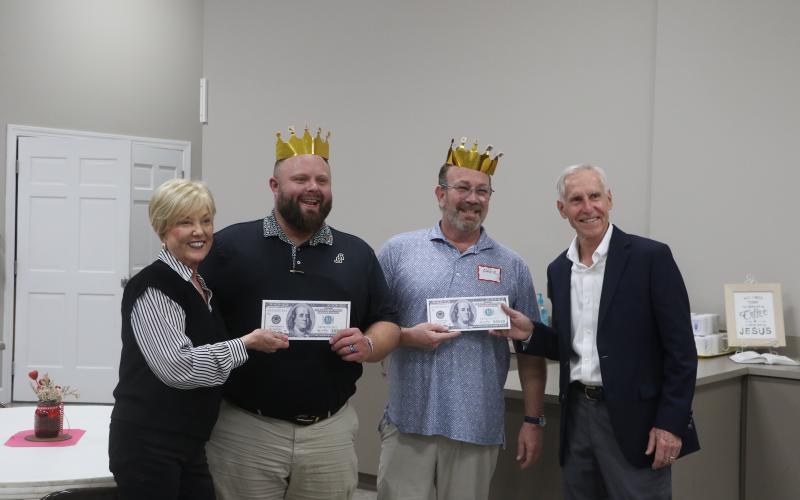 James Carter and Eddie Kurtz are presented their prizes after winning the Lake City Garden Club's annual Scrabble Tournament. (MORGAN MCMULLEN/Lake City Reporter)