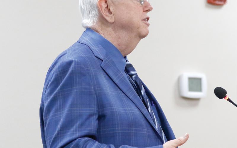 Raftelis Senior Vice President Henry Thomas speaks with the North Florida Water Utilities Authority board about its preliminary rate study. (JAMIE WACHTER/Lake City Reporter)
