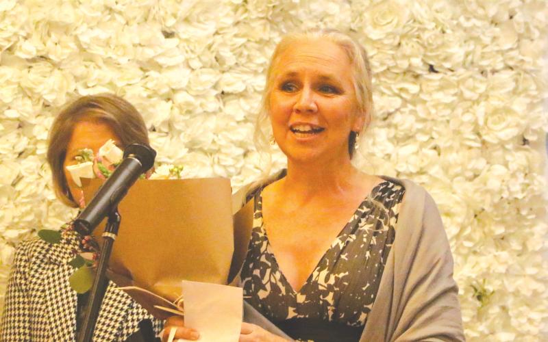 Suwannee Middle School math teacher Stacey Kibbe accepts the 2026 Suwannee County Teacher of the Year award Thursday. (MORGAN MCMULLEN/Lake City Reporter)