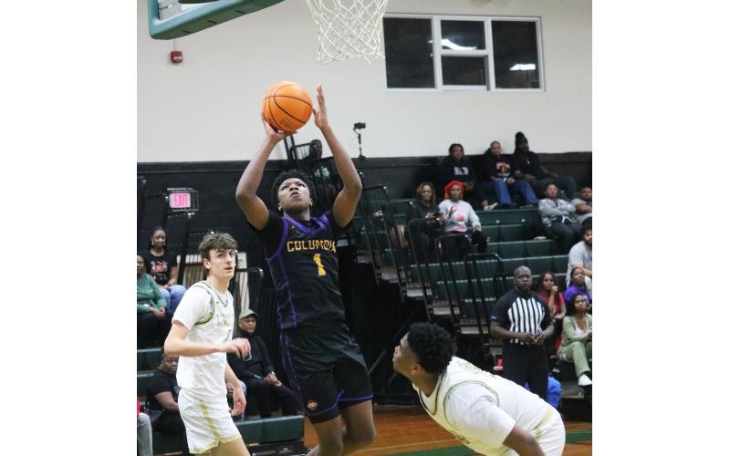Columbia guard Shaheed White shoots against Lincoln during the Region 1-5A quarterfinals on Feb. 14. (JORDAN KROEGER/Lake City Reporter)