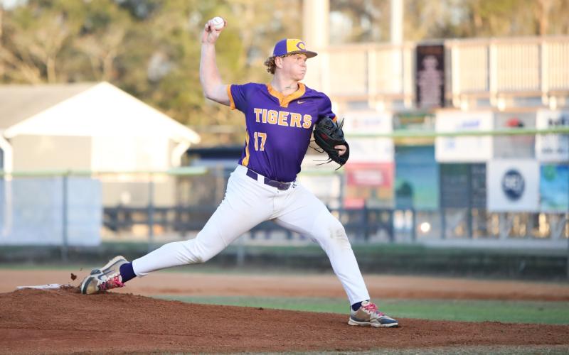 Columbia pitcher Nolan Slaymaker warms up to pitch against Providence on Feb. 24. (BRENT KUYKENDALL/Lake City Reporter)