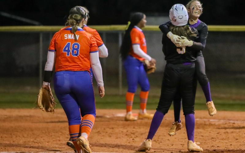 Columbia left fielder Addyson Sherman hugs first baseman Ava Christie (5) after hitting a walk-off single against Branford on Tuesday. (BRENT KUYKENDALL/Lake City Reporter)