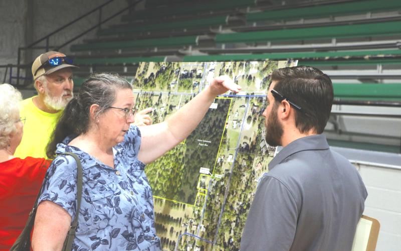 Maureen Bentley (left) speaks with Cory Chandler, an engineer with Landis Evans + Partners during last year’s presentation about the mixed-use development proposed for Live Oak across from the Suwannee County Coliseum. The property owners are now seeking to annex the parcels into the city. (FILE)