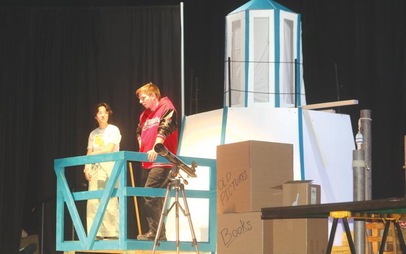 Megumi Boutwell (left) and Casey Dettman practice lines during a scene at a lighthouse for the Fort White High School production of Mystic Pizza. (TONY BRITT/Lake City Reporter)
