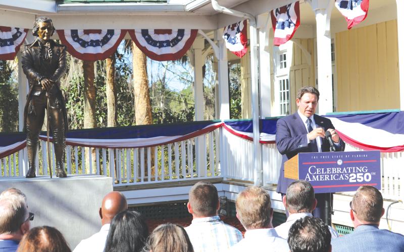 Gov. Ron DeSantis delivers remarks during an unveiling ceremony for a statue of Alexander Hamilton at the Heritage Center in White Springs on Wednesday. (TONY BRITT/Lake City Reporter)