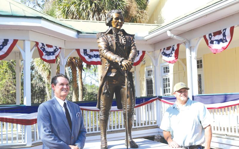 Florida Secretary of State Cord Byrd (left) stands with Bradley Cooley, the sculptor who created Alexander Hamilton statue unveiled on Wednesday at the Heritage Center in White Springs. (TONY BRITT/Lake City Reporter)