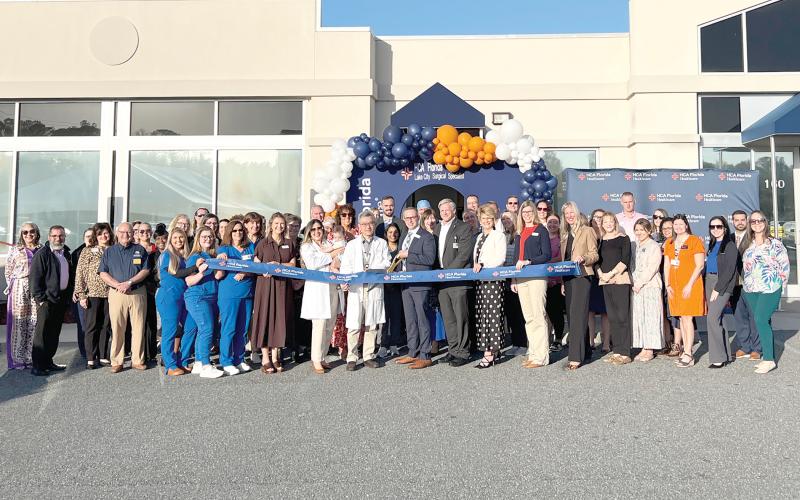 HCA Florida Lake City Surgical Specialists, alongside HCA Florida Lake City Hospital leaders and community members, gather in celebration before the ceremonial ribbon cutting marking the grand opening of the practice’s new location. (COURTESY HCA LAKE CITY HOSPITAL)