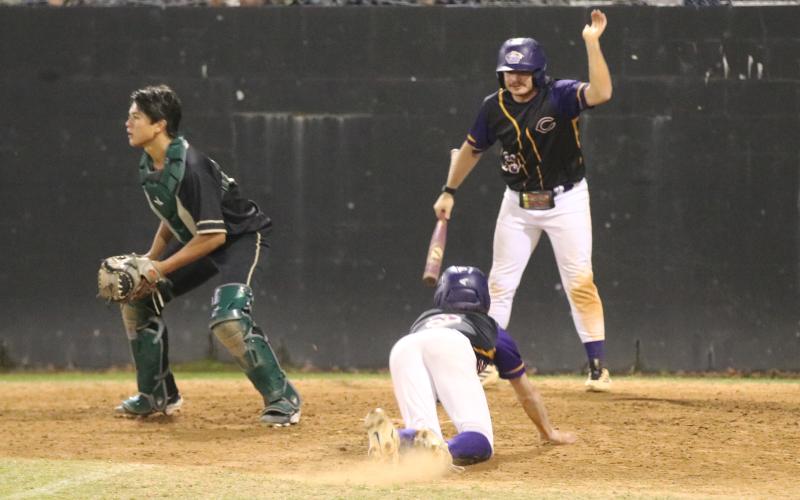 Columbia designated hitter Kyler Keen yells at courtesy runner Nolan Martin to slide as he scores during the Tigers' 10-run sixth inning against Fleming Island on Friday. (JORDAN KROEGER/Lake City Reporter)