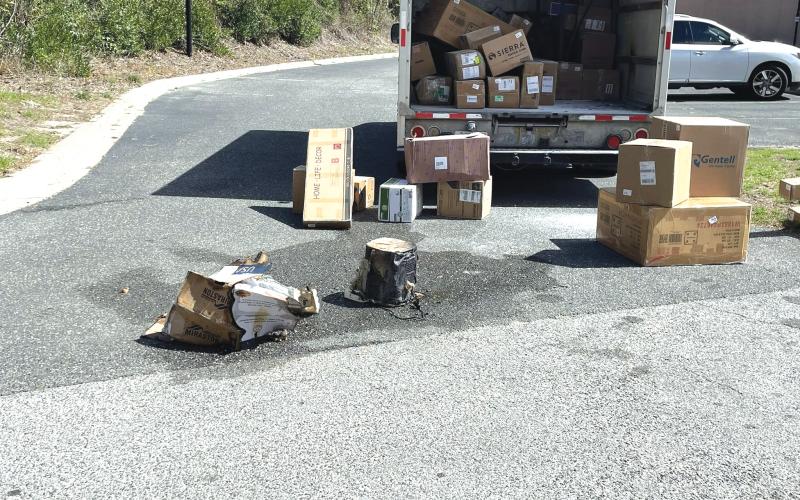 A smoking air fryer caused a brief fire in the back of a FedEx truck Friday morning. The fire was quickly doused after the driver removed the package from the truck. (COURTESY LAKE CITY FIRE DEPARTMENT)