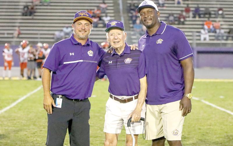 Former Columbia High coach Bobby Simmons (middle) was honored prior to a Tigers’ game in 2023. The school’s all-time winningest coach, Simmons was pictured with CHS Principal Trey Hosford, his son-in-law (left), and CHS coach Brian Allen. (BRENT KUYKENDALL/Lake City Reporter)