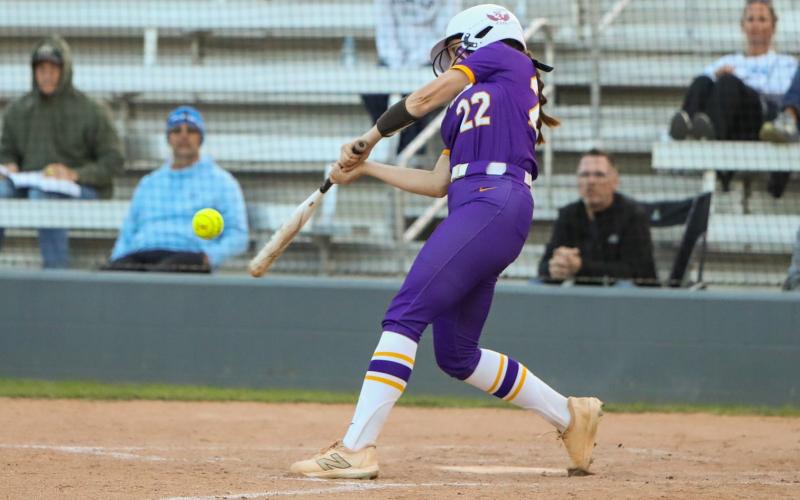Columbia catcher Emily Delgado hits a home run against Bartram Trail on March 19. (BRENT KUYKENDALL/Lake City Reporter)