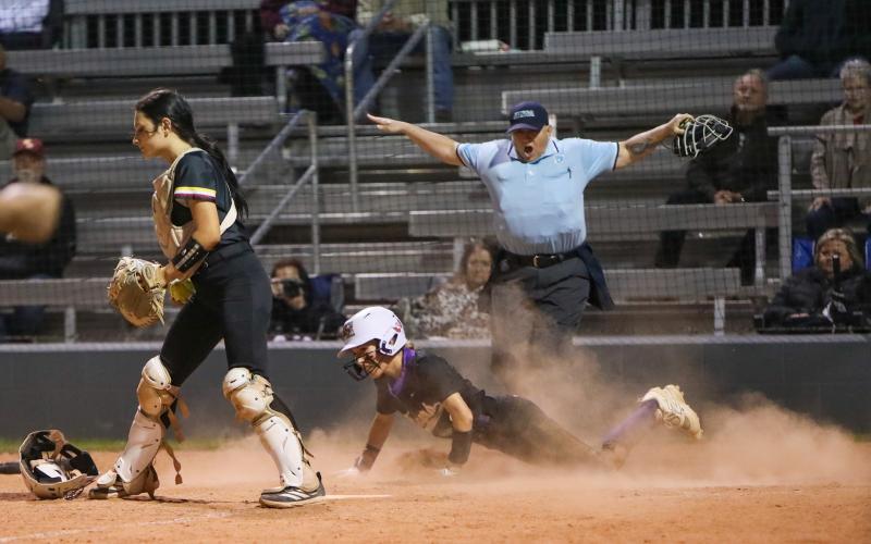 Columbia left fielder Addyson Sherman slides safely into home plate to score the game-winning run in the ninth inning of Thursday's 2-1 win against West Nassau. (BRENT KUYKENDALL/Lake City Reporter)