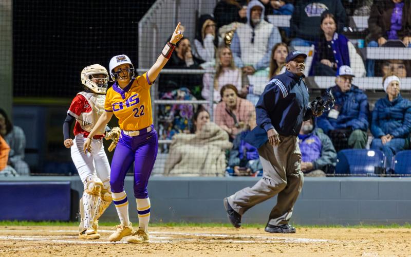 Columbia catcher Emily Delgado points to her home run as it flies over the fence during Tuesday's 13-2 win over Lafayette. (JACK HOWDESHELL/Lake City Reporter)