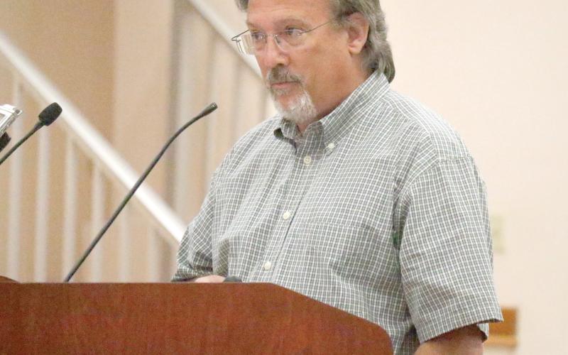 Recoil Trampoline Park owner Trent Coggins, shown speaking before the Columbia County Commission last week, presented to the Lake City Council on Monday. Coggins said the project is moving ahead of schedule and hopefully will be open for next summer. (FILE)