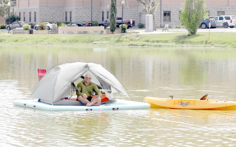 Michael McInally, a Lake City man who has an outdoors YouTube channel, is spending 24 hours floating on Lake DeSoto in downtown Lake City. (TONY BRITT/Lake City Reporter)