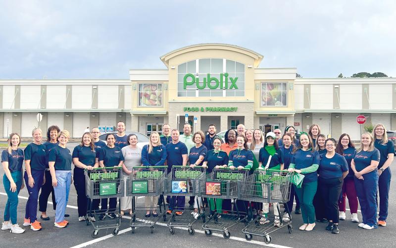 HCA Florida Lake City Hospital colleagues shopped for nonperishable food items to donate to Love INC. (COURTESY)