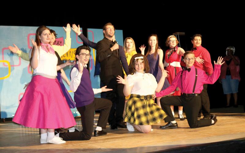 Columbia High School students performing in the school’s production of ‘Hairspray the Musical’ pause after completing a song. (TONY BRITT/Lake City Reporter)