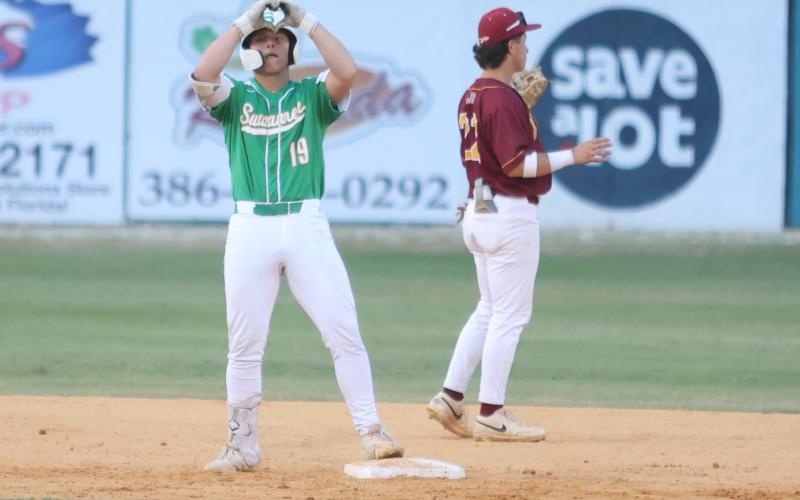 Suwannee pitcher Grayson Greene celebrates at second base after hitting an RBI double against West Nassau during a nine-run second inning in the Region 1-3A quarterfinals on Saturday. (PAUL BUCHANAN/Lake City Reporter)
