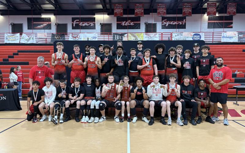 Fort White’s boys weightlifting team poses with the District 6-1A trophies on Wednesday. (COURTESY)