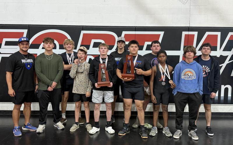Branford’s boys weightlifting team poses with the District 6-1A runner-up trophies on Wednesday. (COURTESY)