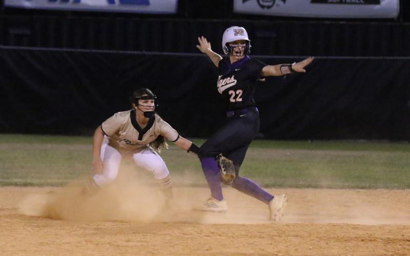 Columbia catcher Emily Delgado (22) signals she's safe at second base ahead of the tag from Buchholz second baseman Avery Fullam during Thursday's 4-2 win. (MORGAN MCMULLEN/Lake City Reporter)