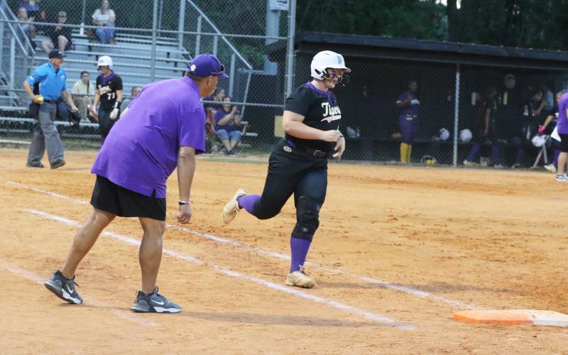 Columbia third baseman Josie Raulerson is all smiles as she rounds third base after hitting a solo home run against Buchholz last Thursday. (MORGAN MCMULLEN/Lake City Reporter)