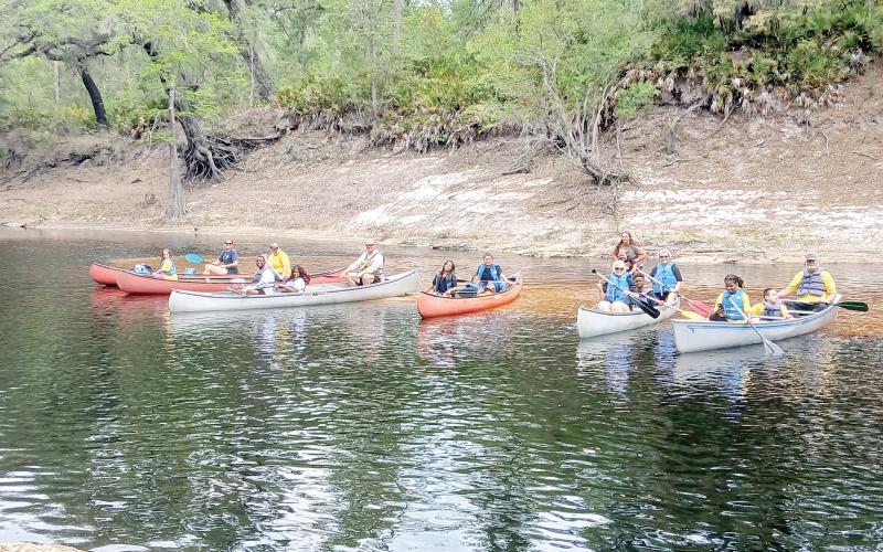 Teams get ready for the canoe race as part of Tri County Day on Saturday at Wayside Park in White Springs. (COURTESY)