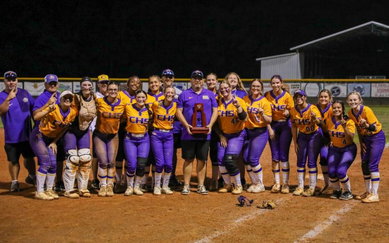 Columbia poses with the District 3-4A championship trophy after defeating Baker County 7-4 on Thursday. (BRENT KUYKENDALL/Lake City Reporter)