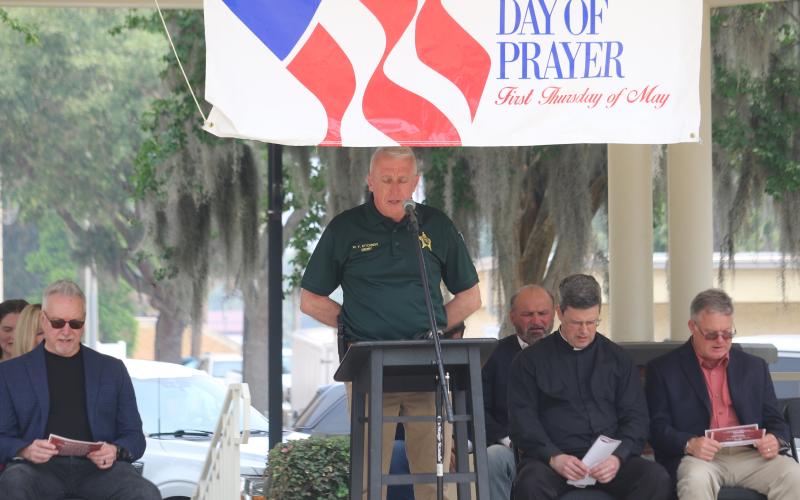 Columbia County Sheriff Wallace Kitchings recites the Lord’s Prayer at the National Day of Prayer observance in Olustee Park on Thursday. (TONY BRITT/Lake City Reporter)