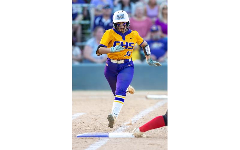 Columbia center fielder Luisa Taylor, a four-year starter, races down the first-base line to try and beat a throw during the Region 1-4A championship against Baker County on May 14. (JACK HOWDESHELL/Lake City Reporter)