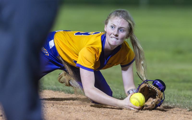 Columbia second baseman Anna Dansby, a four-year starter, dives to field a ground ball during the Region 1-4A championship against Baker County on May 14. (JACK HOWDESHELL/Lake City Reporter)