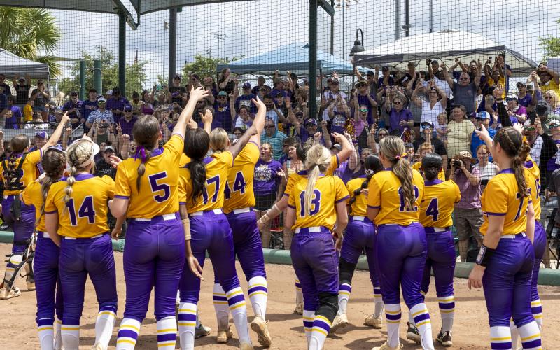Columbia’s softball team celebrates with their cheering fans after defeating Lake Wales to win the Class 4A state title on May 23. (JACK HOWDESHELL/Lake City Reporter)