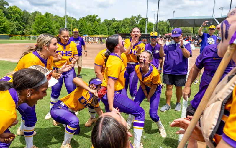 Columbia pitcher Kinley King (middle) yells out the Tigers' 29-3 record following their 3-2 win over Lake Wales in the Class 4A state championship on Saturday. (JACK HOWDESHELL/Lake City Reporter)