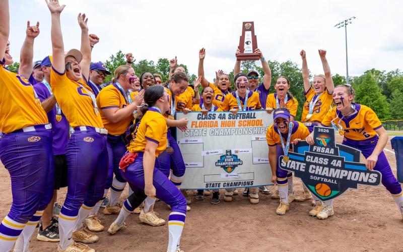 Columbia's softball team celebrates after Ryleigh Stone (77) advanced the Tigers on the Class 4A Final Four bracket following their 3-2 win over Lake Wales in the Class 4A state championship on Saturday. (JACK HOWDESHELL/Lake City Reporter)