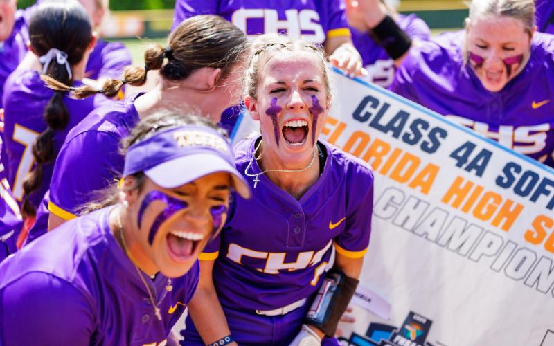 Columbia center fielder Luisa Taylor (left) and left fielder Addyson Sherman celebrate after Sherman advanced the Tigers on the Class 4A Final Four bracket following their 6-5 win over Seminole in the state semifinals on Thursday. (JACK HOWDESHELL/Lake City Reporter)