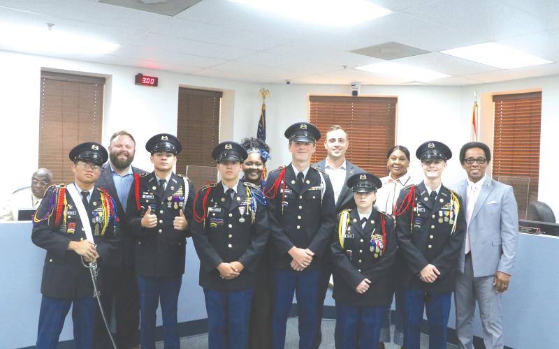 Members of the Columbia High School JROTC program pose with members of the Lake City Council during Monday’s meeting. (MORGAN MCMULLEN/Lake City Reporter)