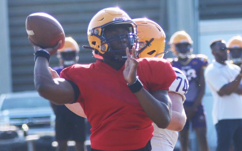 Former Columbia quarterback Xavier Collins throws a pass during spring practice on April 29. Collins departed after practice Tuesday to transfer to Camden County in Georgia. (JORDAN KROEGER/Lake City Reporter)