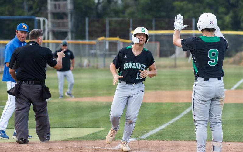 Suwannee first baseman Grayson Greene (19) is greeted at home plate by catcher Jace Moran (9) as he scores a run during Game 1 of the Region 1-3A semifinals on Friday. (ASHLEY CHANDLER/News-Leader)