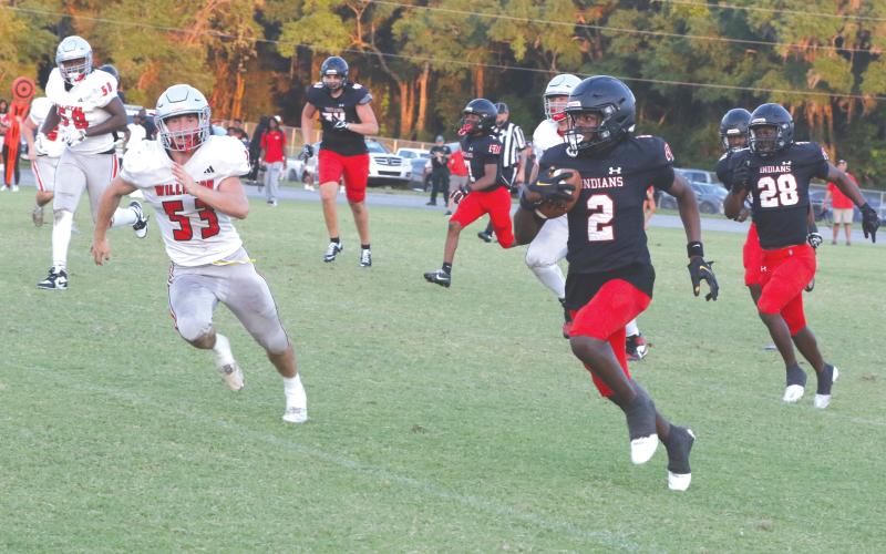 Fort White defensive back Marvion Wallace (2) takes his second interception of the night into Williston territory during Friday’s spring game. (MORGAN MCMULLEN/Lake City Reporter)