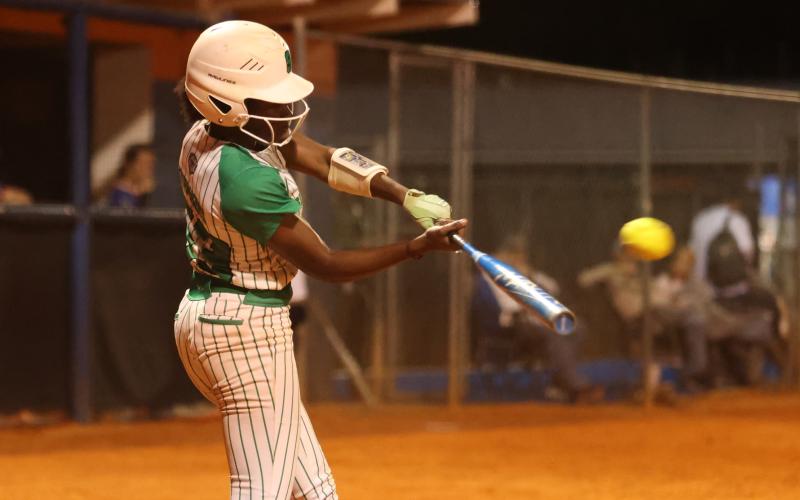 Suwannee outfielder Brianna Stephens-Woods swings at a pitch against Branford on March 19. (PAUL BUCHANAN/Lake City Reporter)