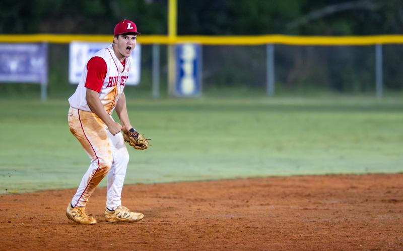 Lafayette shortstop Trevor Byrd (3) celebrates after recording the final out in the Hornets' comeback win over Aucilla Christian in Game 3 of the Region 3-R semifinals on Saturday. (JACK HOWDESHELL/Lake City Reporter)